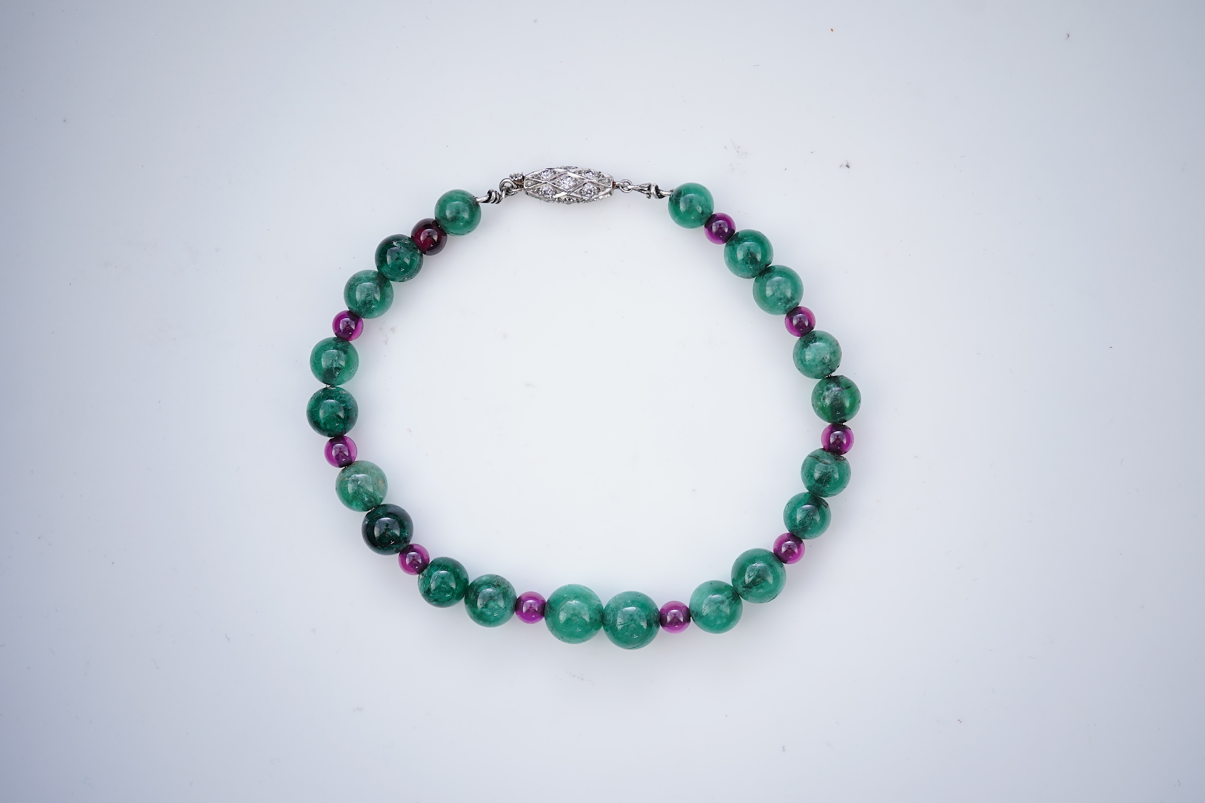 An Art Deco emerald, synthetic ruby and diamond bracelet, first half 20th century
